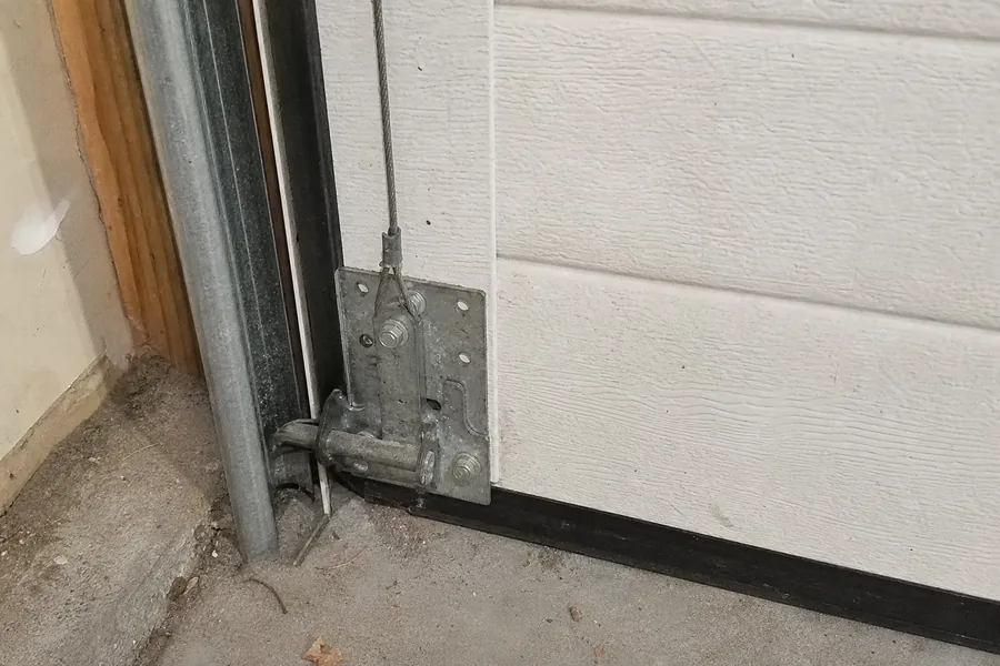 Bottom bracket, lift cable and roller on a garage door in Bellevue, WA