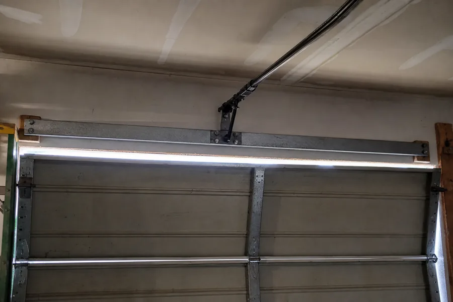 Reinforcement strut across the top panel of a double garage door in Bellevue, WA