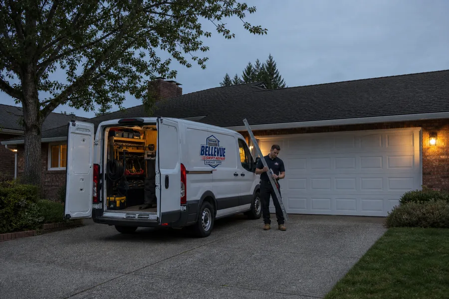 A Swift Garage Door Repair technician bringing a torsion spring from the van in Bellevue, WA